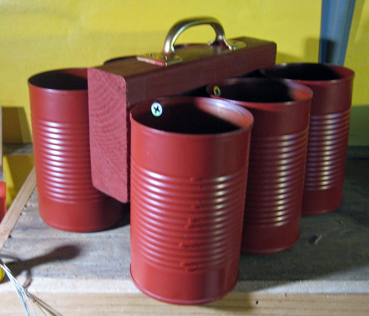 Homemade Tool Caddy of soup cans, handle and wood