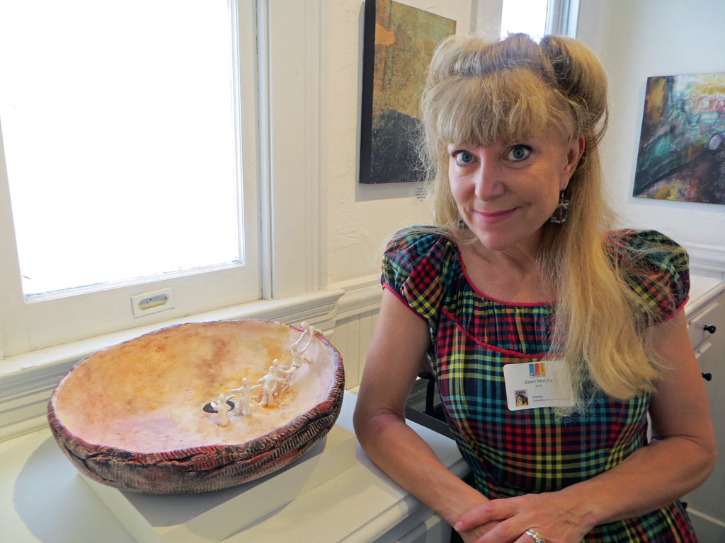 Dawn Motyka with her ceramic bowl "Sipa Pu: Hopi Creation Myth"