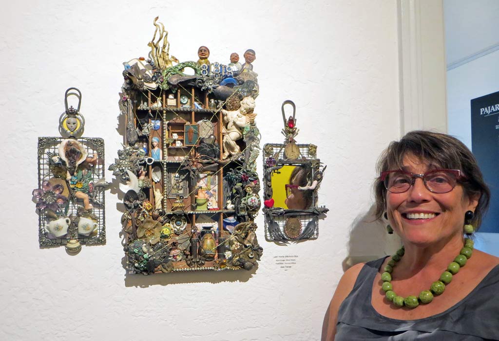 Joan Tanzer standing next to her assemblage artwork titled "Lost Home Memory Box"