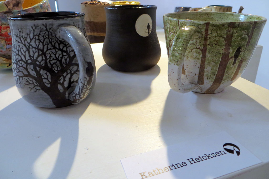 Three ceramic mugs with birds