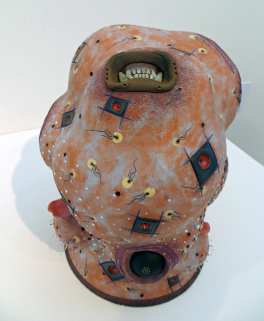 ceramic sculpture in blob form with small shapes by Brad Blair