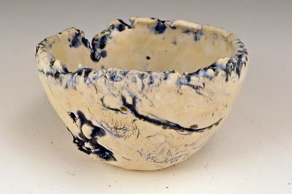 Small hand formed wabi sabi ceramic bowl.