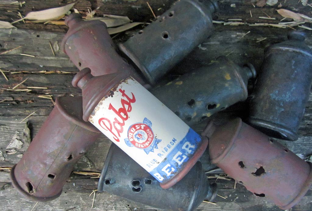 Ceramic Pabst Beer Can on Nest of Rusty Shot up Cans