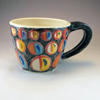 ceramic mug with colorful circle decoration