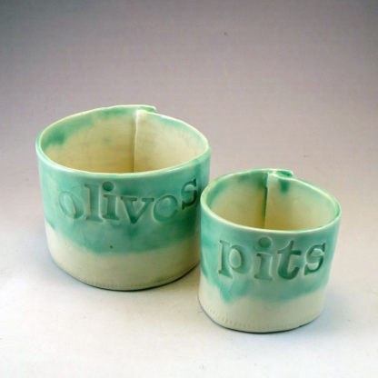 two ceramic cylinders for Olives and Pits