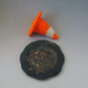 traffic cone and pothole plate